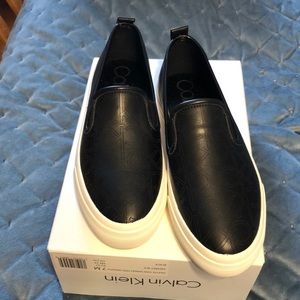 NWTIB Calvin Klein size 7 slip on black sneakers